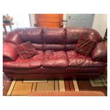 Red 7 ft leather style couch