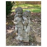 Concrete boy and girl yard decor