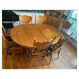 Oak pedestal table, six chairs, two leaves