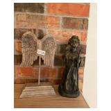 Shepherd girl with lamb and angel wing decor
