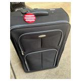 Samsonite black rolling suitcase
