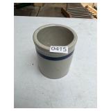 Blue and cream colored crock
