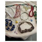 Costume jewelry.  Green necklace need sm repair.