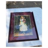 Framed girl with flower picture