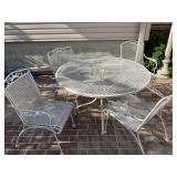 White wrought iron patio table and 4 chairs