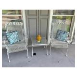 2 wrought iron chairs, pilows, and table