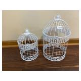 Two white bird cages