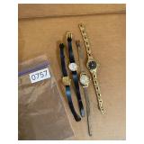 4 black and gold watches