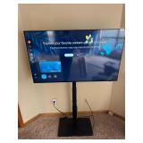 55 inch Samsung flatscreen TV w/stand and remote