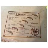 Smith and Wesson metal tin sign