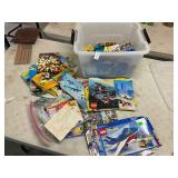 Tote full Lego boxes and papers