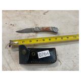 Damascus style knife with leather sheath