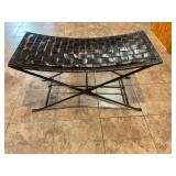 Black wicker plastic bench with metal frame