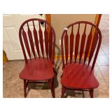 2- red wooden chairs