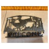 Metal deer welcome sign