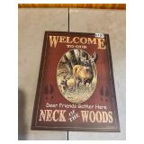 Metal welcome neck woods sign