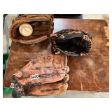 3 baseball gloves