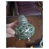 silver colored metal and glass blown in green