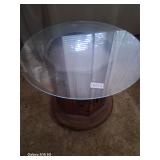round glass on top of wooden end table