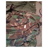 Pile of various sized BDUs and Fatigues