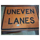 Uneven lanes street sign