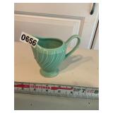 Teal green ribbed creamer. Small chip