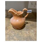 Orange brown ceramic pitcher