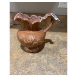 Brown pottery pitcher