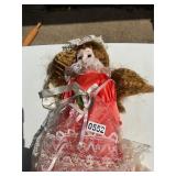 Porcelain doll with red dress