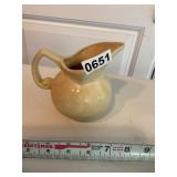 Blue and pink design pitcher. Small chip
