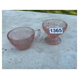 2- pink depression glasses. One has chip