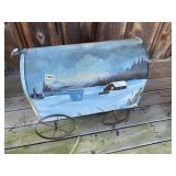 Large painted mailbox on wheels