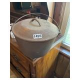 Cast iron number eight footed Dutch oven