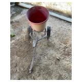 Red round, earthway seeder