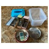 Sewing machine parts in plastic box