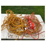 2 large extension cords and drop light