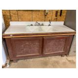 Cast-iron double sink and wood cabinet