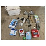 Igloo cooler, plasticware, tongs, cutter, all