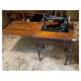 Antique singer, sewing machine and cabinet