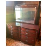 Dark cherry colored dresser with mirror