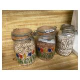 Three glass jars and contents