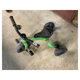 Green and black confident tricycle