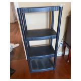 Four tier black plastic shelf