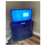 32in RCA flat screen tv and corner cabinet