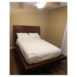 Full size mattress on wooden slat/platform bed