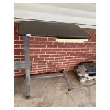 Adjustable bedside table