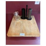 Chopping block, heavy salt and pepper shakers, etc