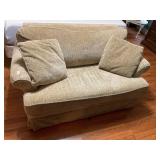 Tan love seat with full hide-a bed