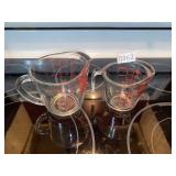 Two glass measuring cups
