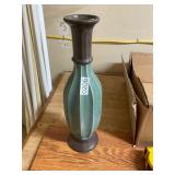 Green ribbed vase with brown tips